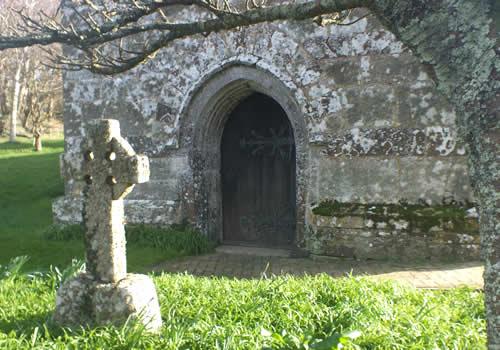 Ancient doorway and cross at St Colan Parish Church Photo Gallery Image - Ancient doorway and cross at St Colan Parish Church